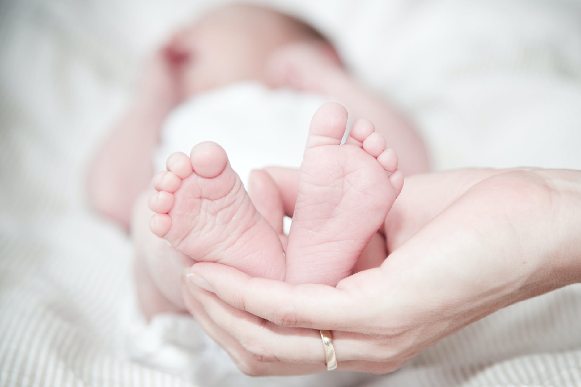 pexels-photo-325690 - The Paris Post This is why Indian Newborn Baby Care Is Getting More Popular close up of hands holding baby feet