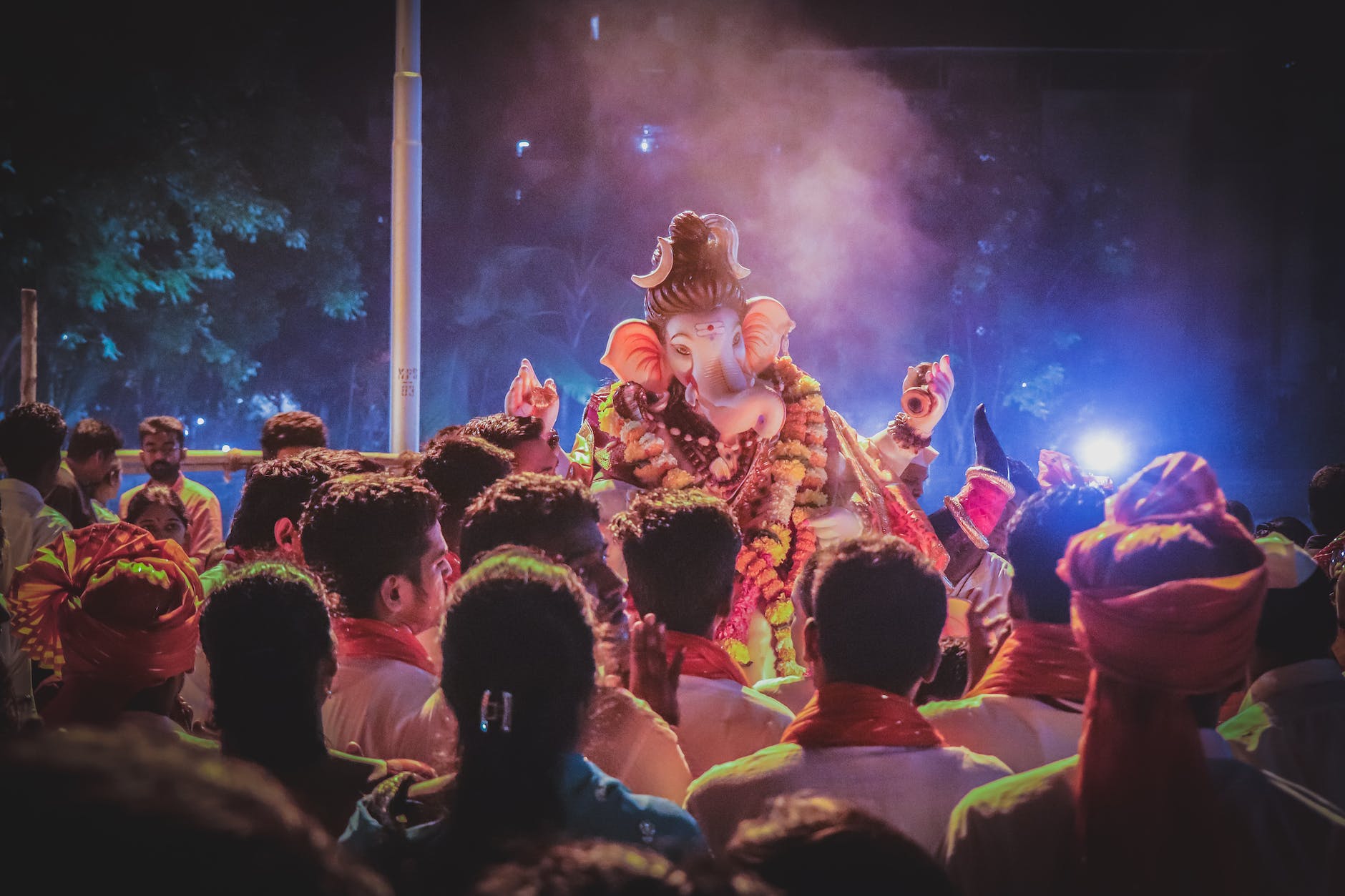 pexels-photo-1707402 - The Paris Post Ganesh Utsav | photo of people standing in front of ganesha statue