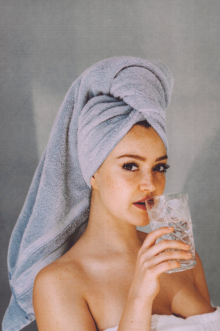 pexels-photo-4946942 - The Paris Post woman with glass of water after shower after virechana benefits a panchakarma health benefits