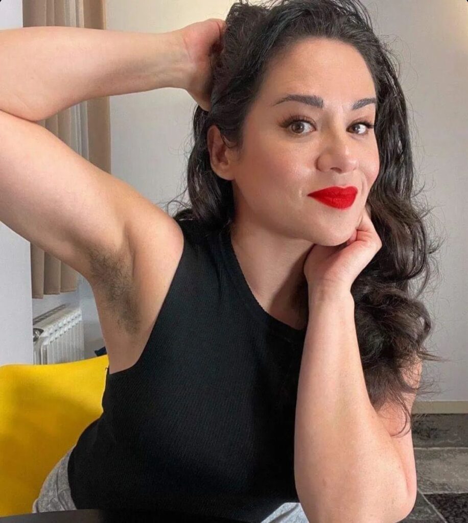 hairy-armpit-from-instagram-2 - The Paris Post Female wearing a black top and red lipstick