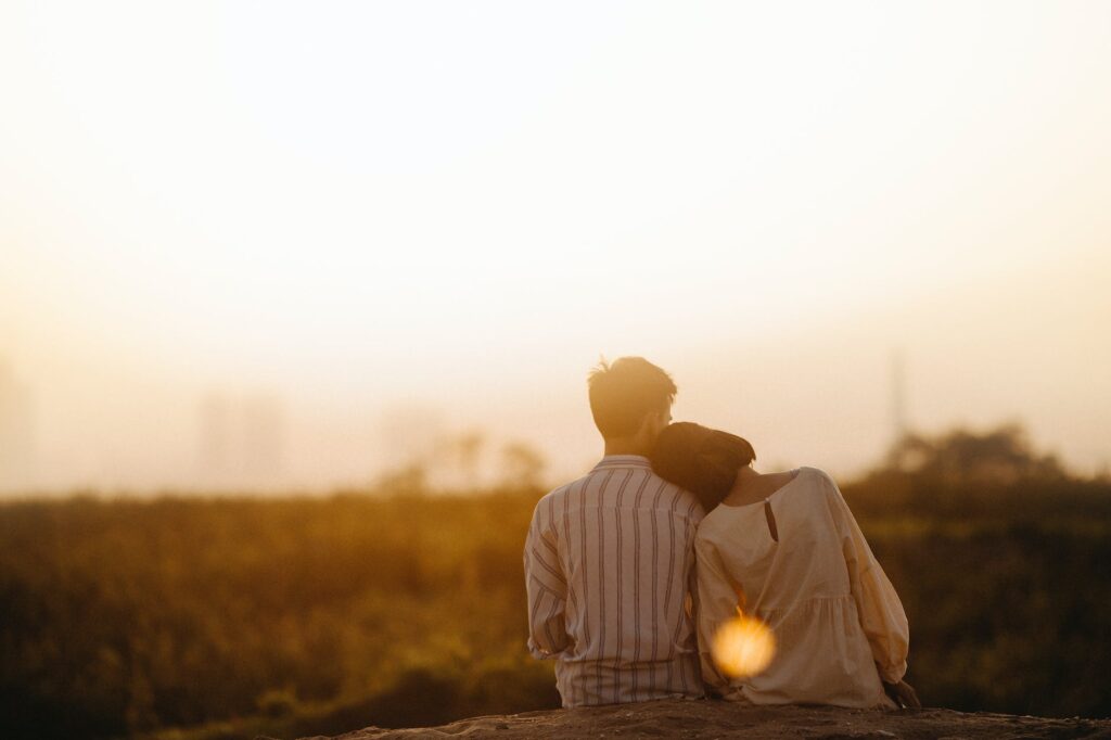 man and woman near grass field Hatred Vs Love