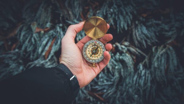person holding compass | Lost Ones
