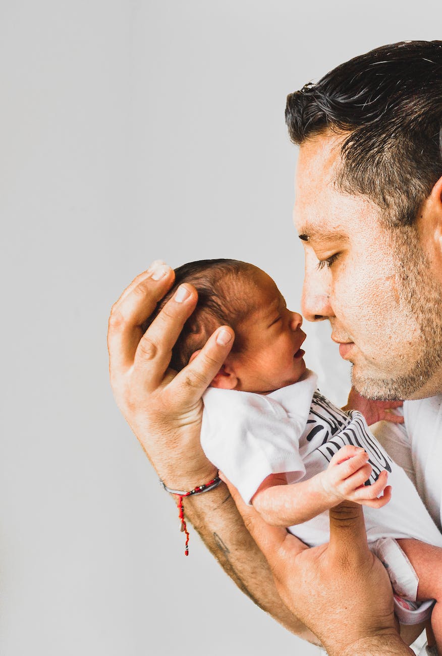 pexels-photo-3617853 - The Paris Post Self-hating after pregnancy stretch marks remove naturally | photo of man carrying newborn baby