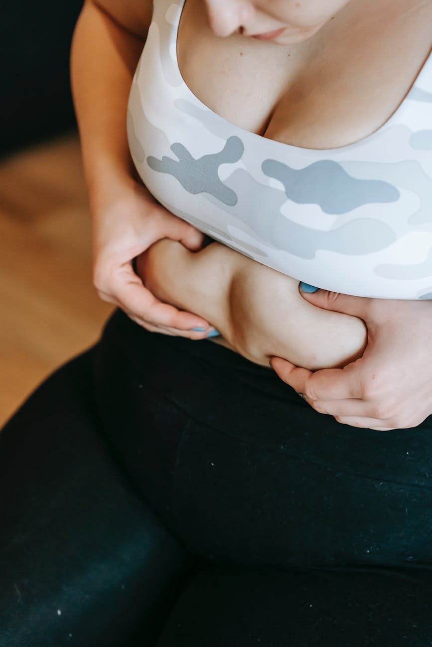 pexels-photo-6551455 - The Paris Post Unbelievable, 100% result | Self-hating after pregnancy stretch marks remove naturally | anonymous overweight woman touching tummy during training