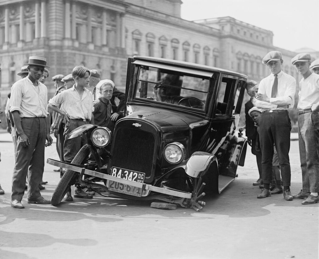 automotive-defect-broken-car-wreck-78793 - The Paris Post grayscale photo of people standing near the wrecked vintage car | Road Safety Week: Avoid risk of accident