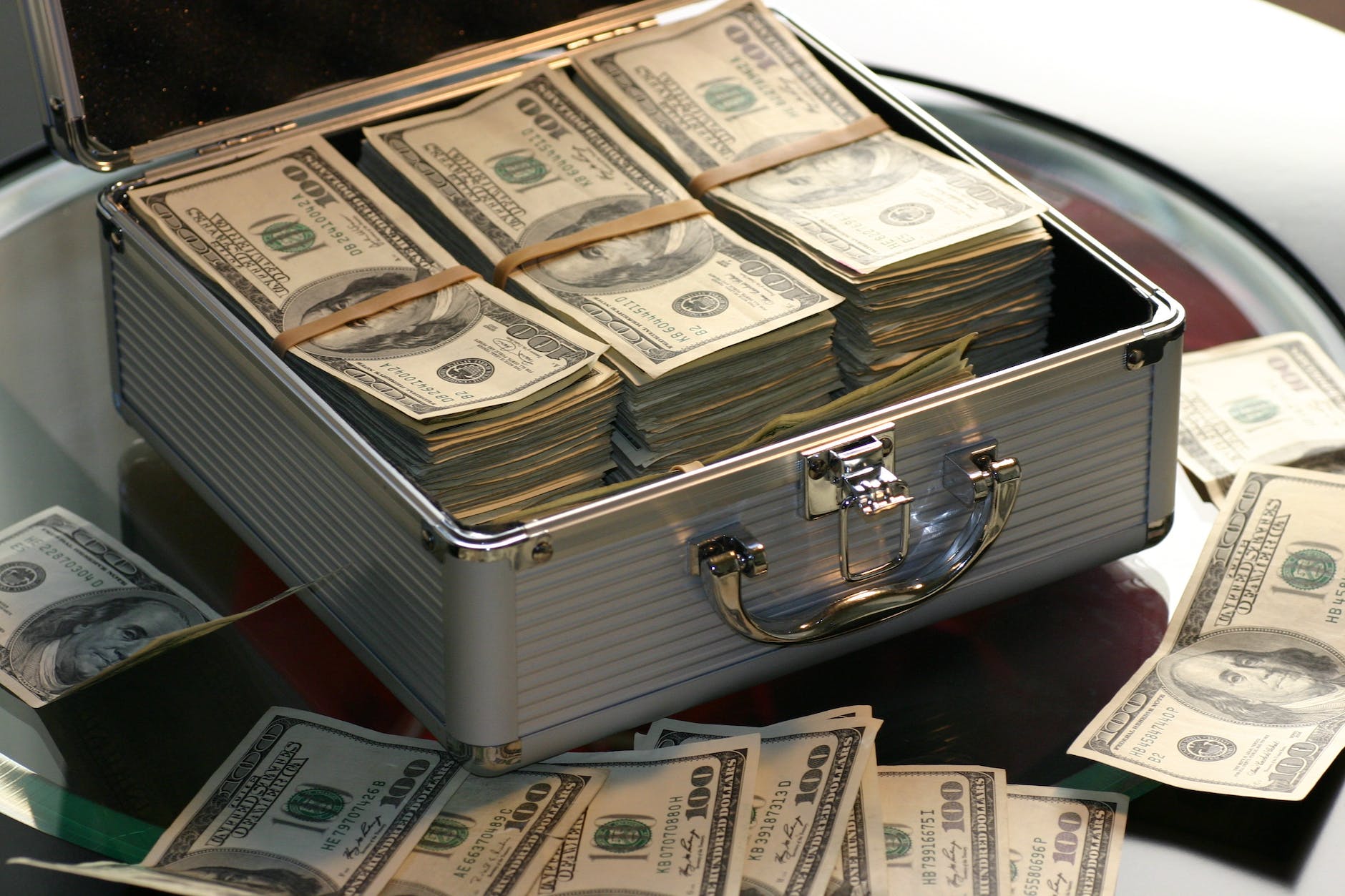 pexels-photo-259027 - The Paris Post hard cash on a briefcase Cash flow definition