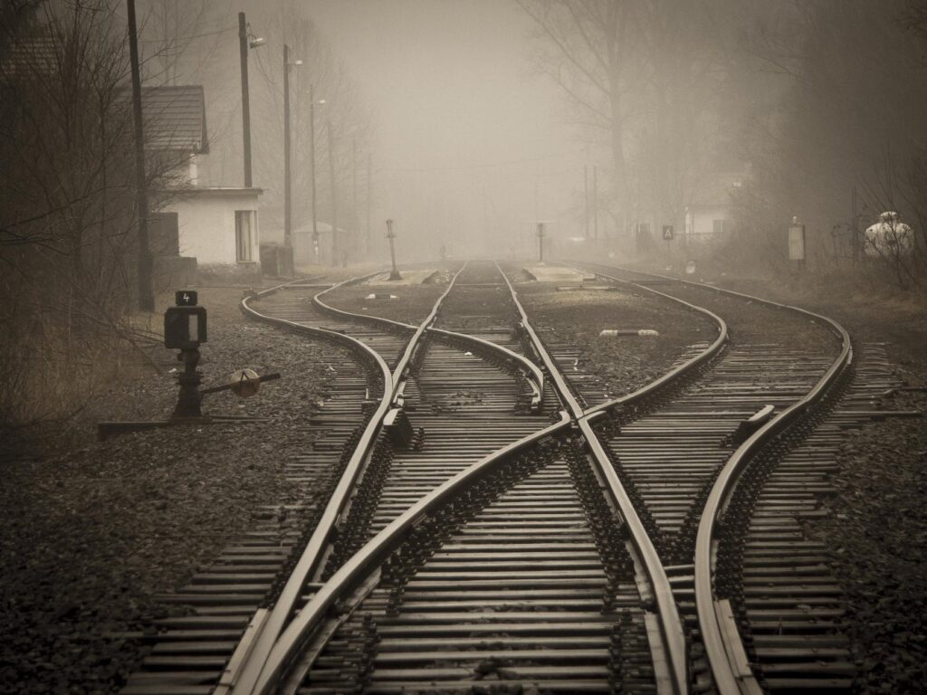 railroad tracks in city | Poem: To The Next Station