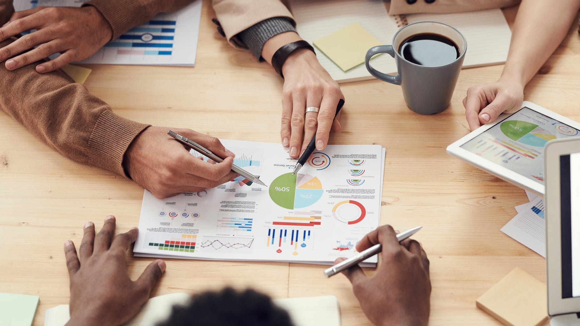 pexels-photo-3184292 - The Paris Post people discuss about graphs and rates | Business Guest Posting | Photo by fauxels