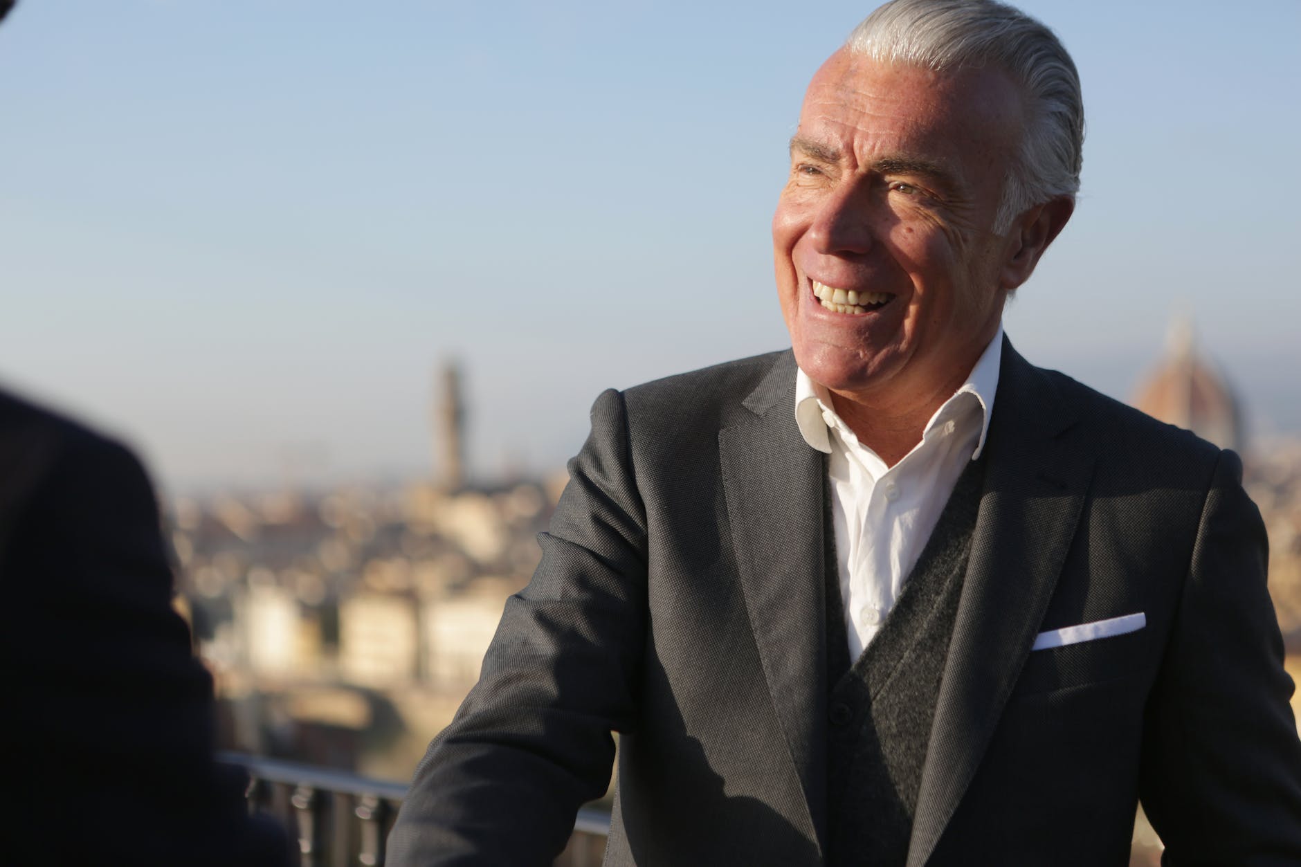 pexels-photo-3783577 - The Paris Post cheerful senior businessman shaking hands with partner on street