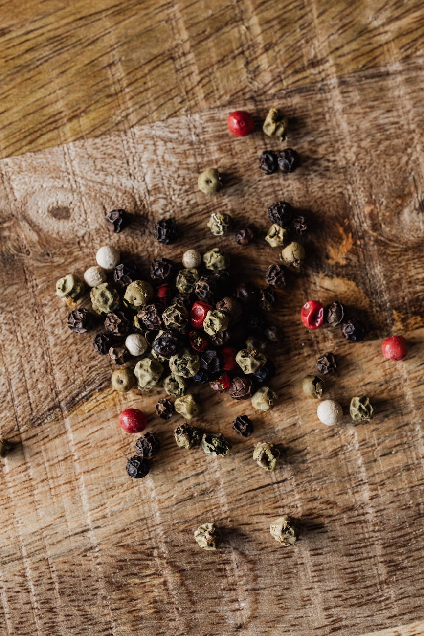 pexels-photo-4198658 - The Paris Post mix of pepper seeds on wooden surface