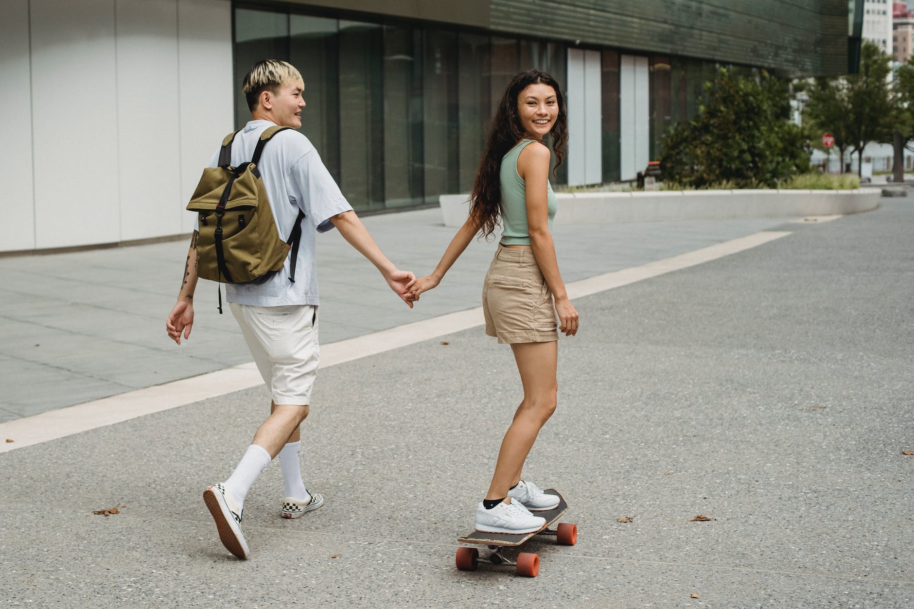pexels-photo-5225146 - The Paris Post cheerful asian couple holding hands and strolling together | Walking 30 minutes a day: Boost your strength, power, and endurance.