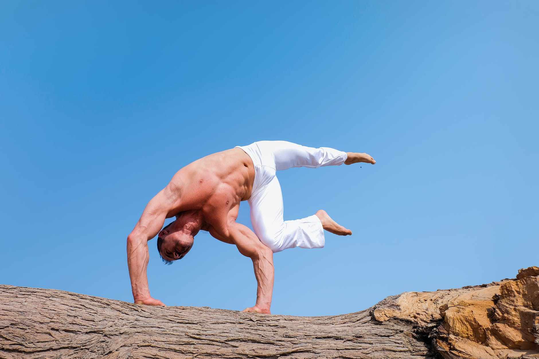 pexels-photo-999309 - The Paris Post man wearing white pants under blue sky | To increase productivity follow these 6 exercises daily