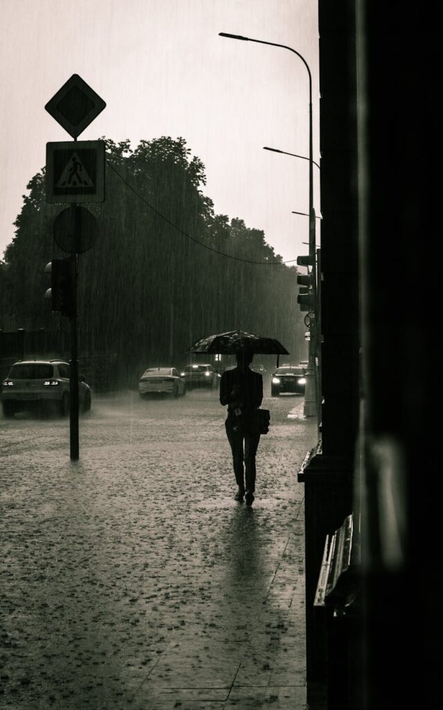 person with an umbrella walking on the street: A poignant tale of longing, fleeting connection, and unspoken love—Half Past Six follows a solitary young man whose chance encounter at a railway station leads to a bond marked by time, loss, and the haunting pull of memory.